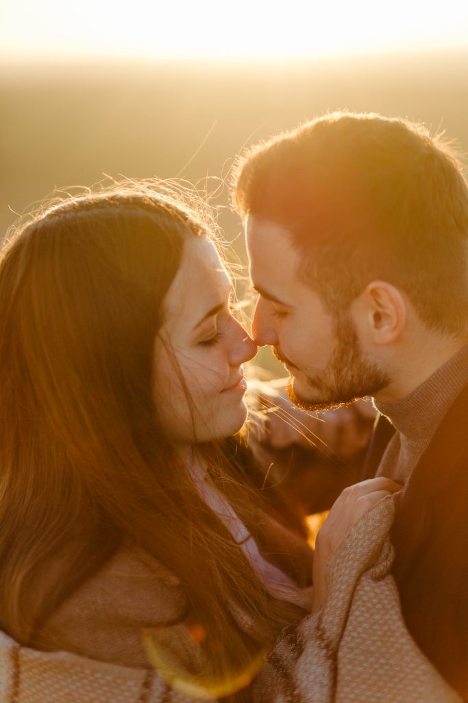 Young and beautiful couple walking outdoors on a sunny day
